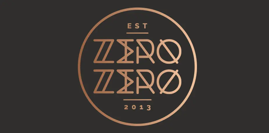 Zero Zero circular logo in copper on dark background